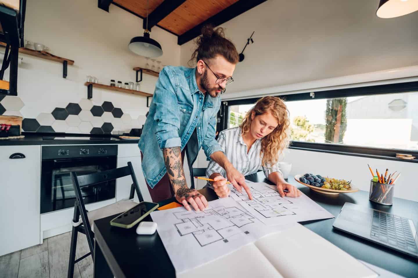 couple looking at home blueprints